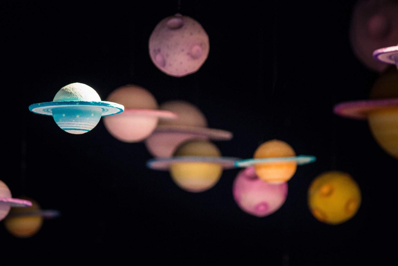 model planets in pinks and blues