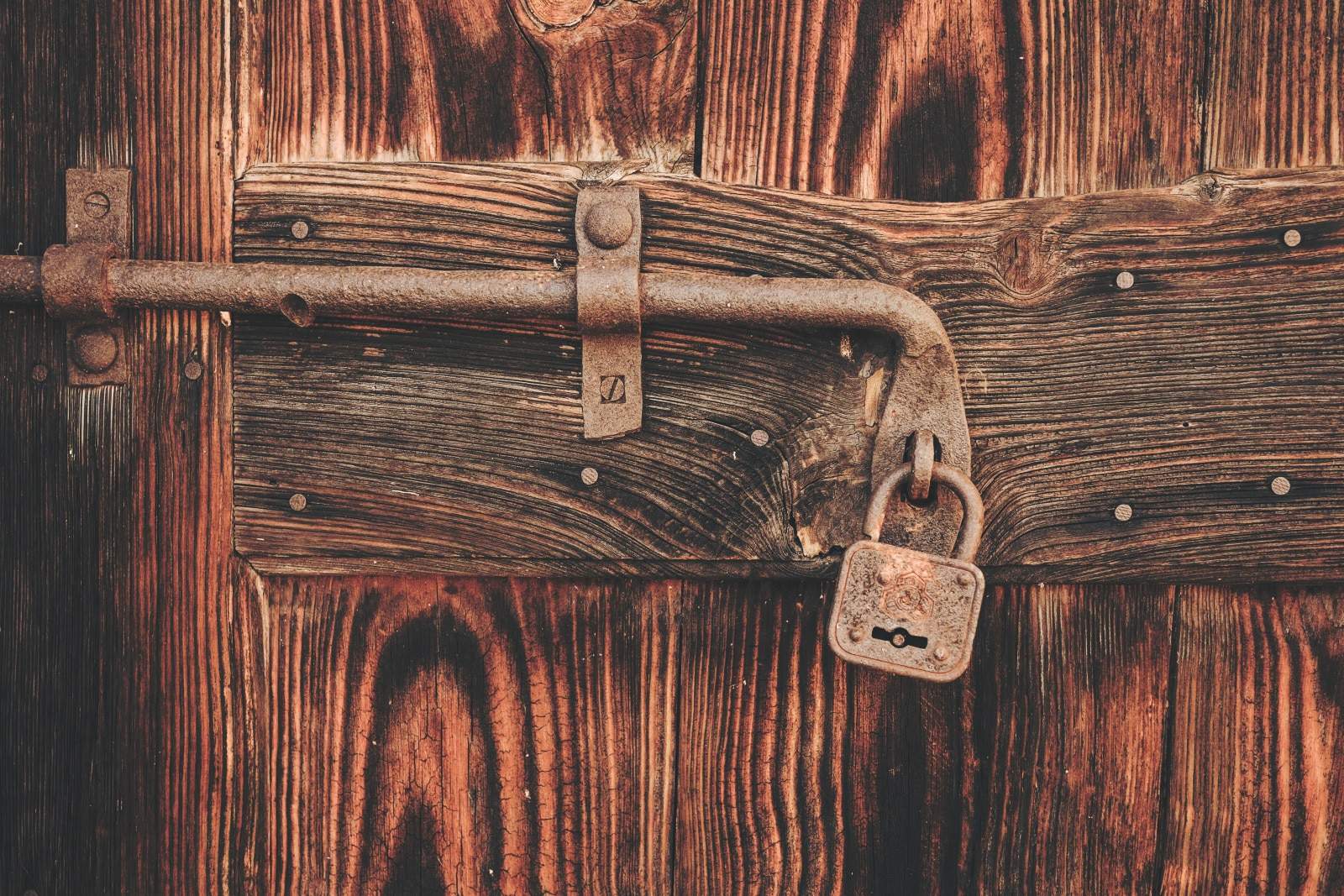 rustic textured door with heavy lock