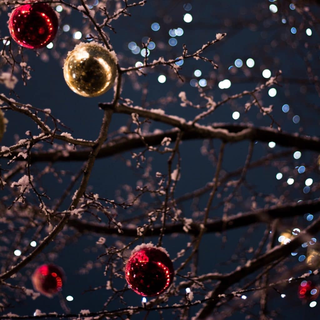 red and gold ornaments shining against the night sky