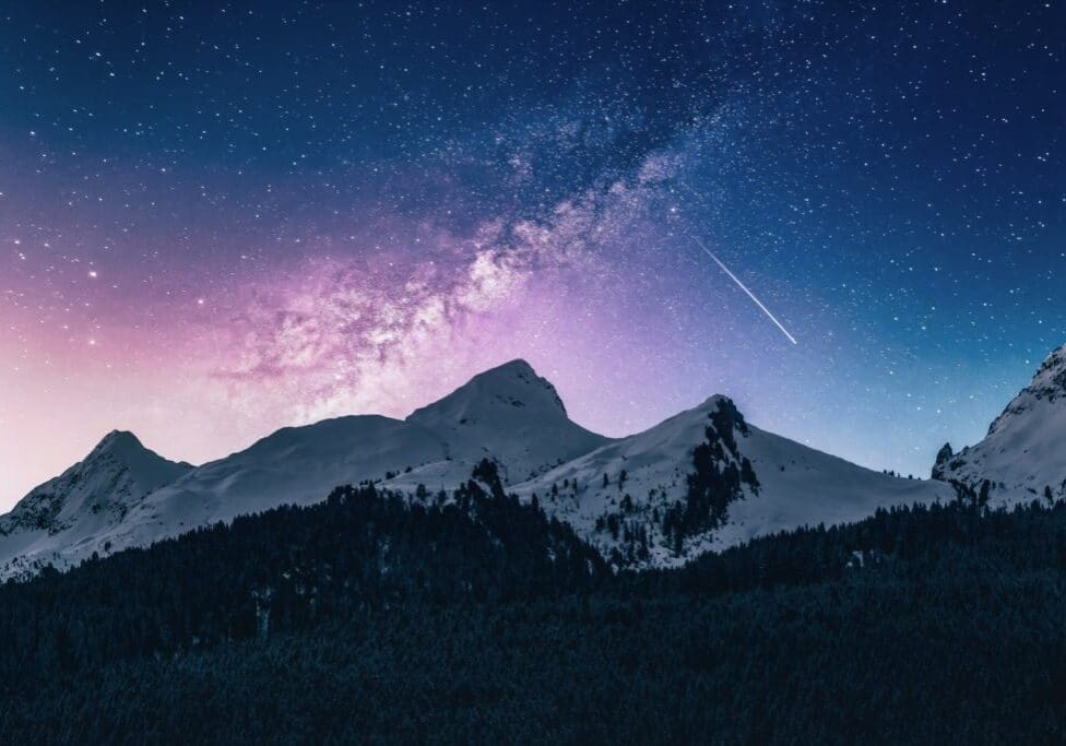 stunning mountain sky with shooting star