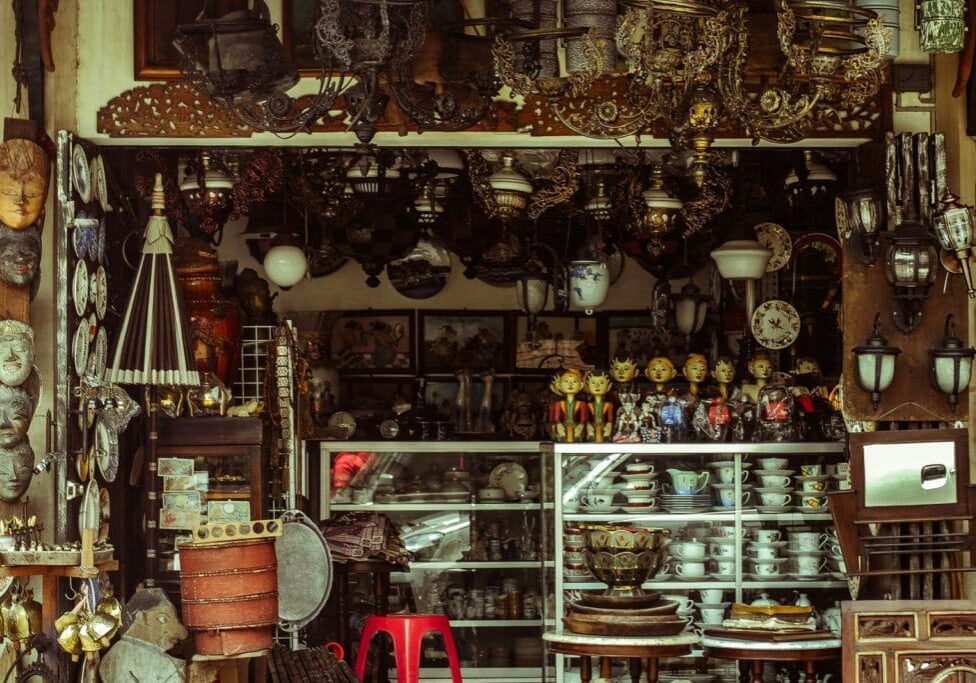 antique shop with lots of brass and jars